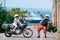 A couple of motorcycle riders happy dance. Love and relationships. Tourism and travel. Motorcycle for tours around the world.