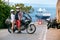 A couple of motorcycle riders. Love and relationships. Tourism and travel. Motorcycle for tours around the world. Street of sunny