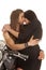 Couple motorcycle wear black almost to kiss