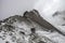 Couple of mountaineers walking along a snow-filled route of the Iztaccihuatl - Popocatepetl National Park in Mexico