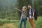 Couple navigate with smart phone while hiking