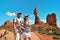 Couple near Balanced Rock in Arches National Park USA