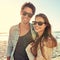 Couple, ocean and sunglasses with hug, smile or care for fashion, eye protection or vacation in summer. Man, woman and