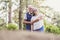 Couple of ol caucasan people mature man and woman hug together in. relationship - outdoor leisure activity for active senior -