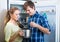 Couple opened fridge looking food