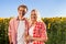 Couple outdoor countryside sunflowers field blue sky smile