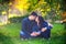 Couple outdoors enjoying a summery day looking happy