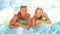 Couple Outside Relaxing In Swimming Pool