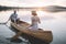 Couple paddling canoe