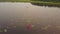 Couple paddling in kayaks enjoying a calm, misty lake.