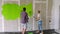 A couple paints the wall green, chromakey