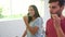 Couple In Pajamas Brushing Teeth In Bathroom