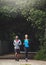 Couple in park, running together and fitness in nature, exercise and training for marathon with bonding and sports