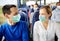 Couple of passengers in medical mask in travel bus