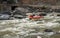 The couple - passengers and rubber boat steering - rafting on river Beas