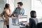 Couple passengers talking to check in airline staff in airport terminal building before boarding on the airplane. Asian woman and