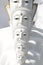 Couple peaceful white buddha statues sitting well alignment and decorating wonderful attractive mirror