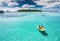 Couple on a pedalo boat in Maldives