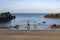 A couple of people on Playa Chica Beach in Puerto del Carmen during sunrise, Lanzarote, Spain