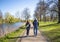 A couple of people walk along the roads to the parks