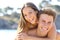 Couple with perfect smile posing on the beach