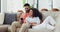 Couple, phone and relax on sofa with conversation, communication and talking for social media or internet. Love, man or