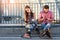 Couple with phones sitting.