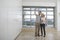 Couple Photographing Empty Apartment