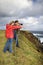 Couple photographing scenery in Maui, Hawaii.