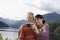 Couple Photographing Themselves Against The Mountains