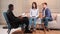 Couple at phycologist appointment sitting in modern office