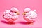 A couple of pink and yellow colored small chickens on pink background, generative ai