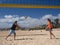 Couple is playing beachvolleyball