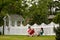 Couple Playing by Fence - horizontal