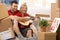 Couple playing guitar together in new house