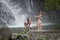 Couple Playing Under Waterfalls