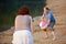 Couple playing volleyball with beach ball