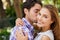 Couple portrait, hug or cheek kiss on romance date, love or valentines day in park, backyard bonding or relax garden
