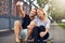 Couple posing for a selfie on a skateboard