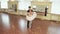 Couple practicing ballet dancing in front of mirrors, slow-mo