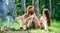 Couple prepare roasted sausages snack nature background. Hike picnic traditional roasted food. Camping and picnic