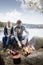 Couple Preparing Bonfire During Lakeside Camping