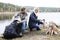 Couple Preparing For Camping On Lakeshore