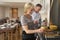 Couple Preparing Food For A Dinner Party