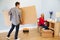 Couple Preparing To Assemble Flat Pack Furniture In Nursery