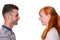 Couple in profile smile at each other