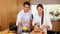 Couple putting fruits into a blender