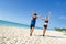 Couple reaching goal at the beach