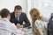 Couple With Real Estate Agent In Office