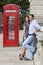 Couple & Red Phone Box in London, England